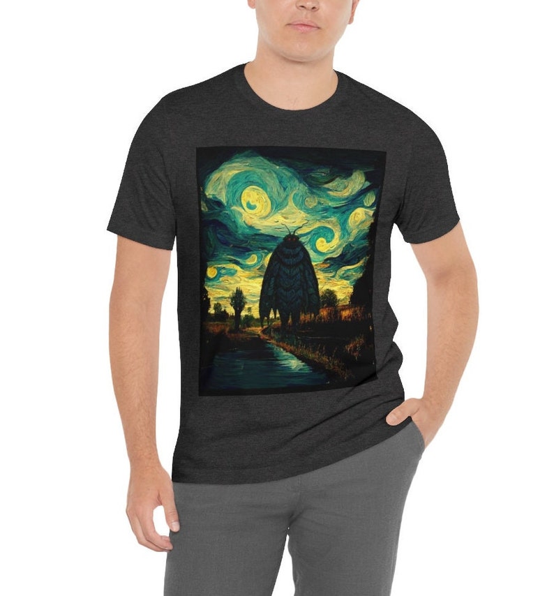 May include: A dark heather grey t-shirt with a graphic print of a large moth standing in a field with a starry night sky in the background. The graphic is reminiscent of Vincent van Gogh's "Starry Night" painting.