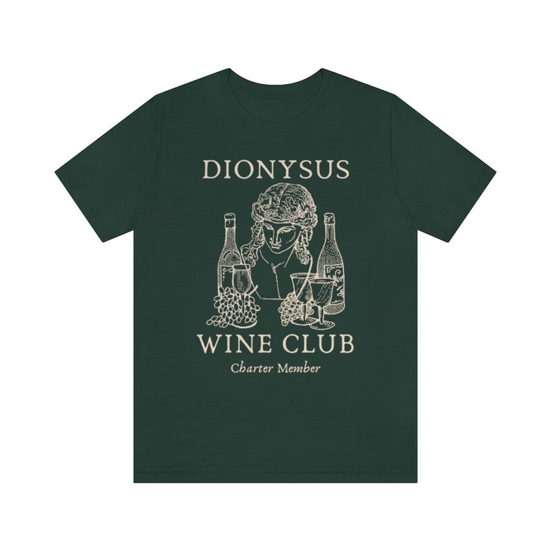 May include: A dark green t-shirt with a white graphic design of a bust of Dionysus with grapes, wine bottles, and wine glasses. The text "Dionysus Wine Club Charter Member" is printed below the graphic.