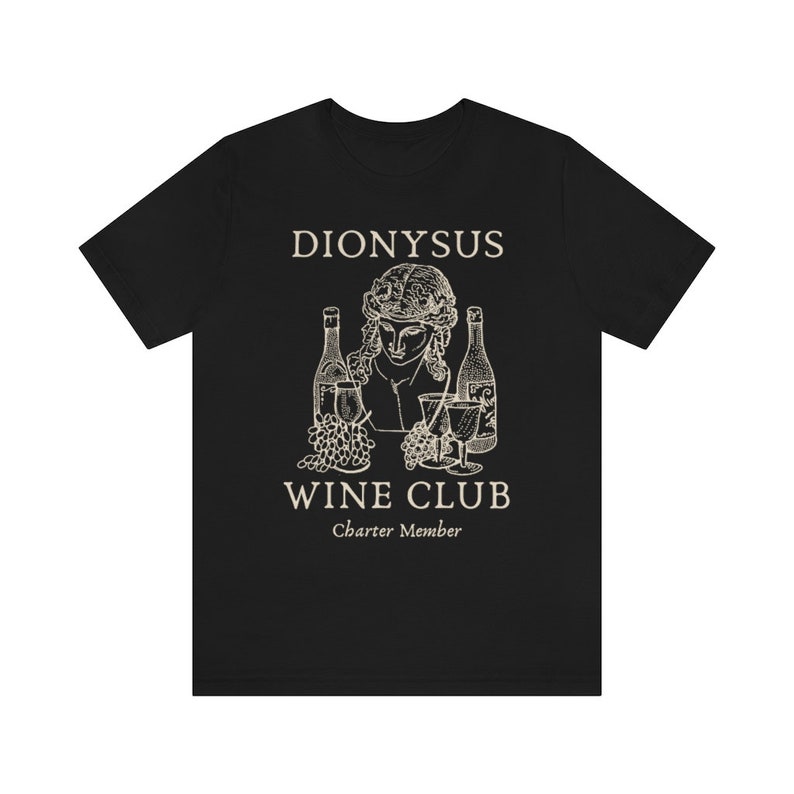 May include: Black t-shirt with a white graphic of a bust of Dionysus with wine bottles and grapes. The text "Dionysus Wine Club Charter Member" is below the graphic.