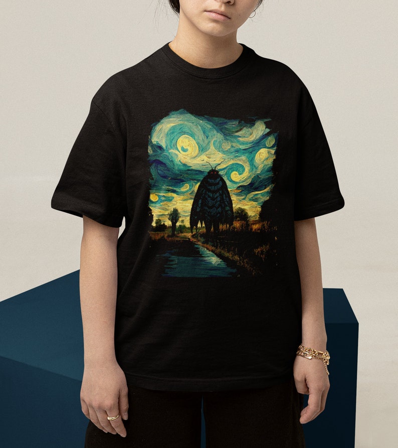 May include: Black t-shirt with a graphic print of a large moth in a starry night sky, reminiscent of Vincent van Gogh's painting.