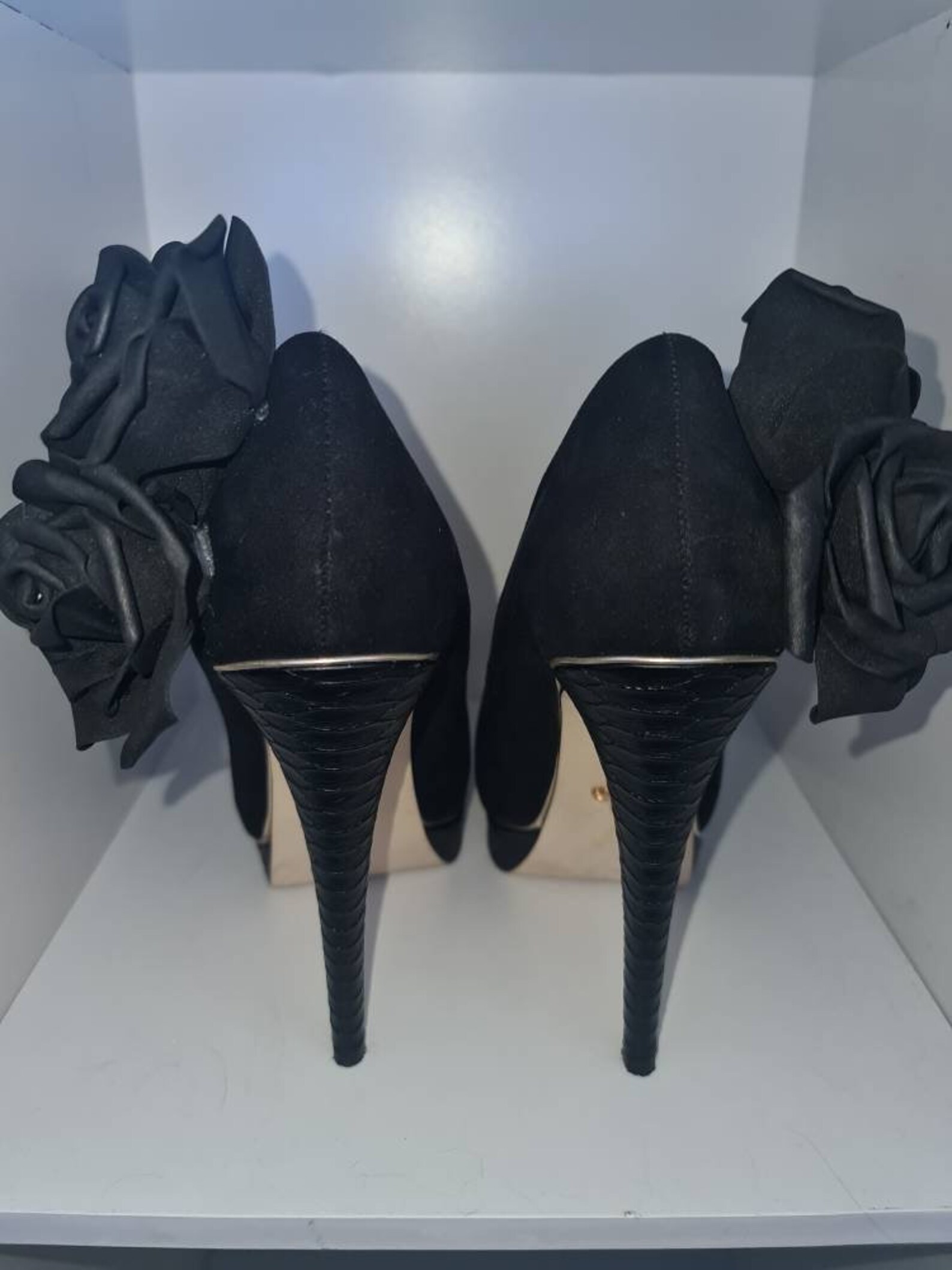 black high heels with roses