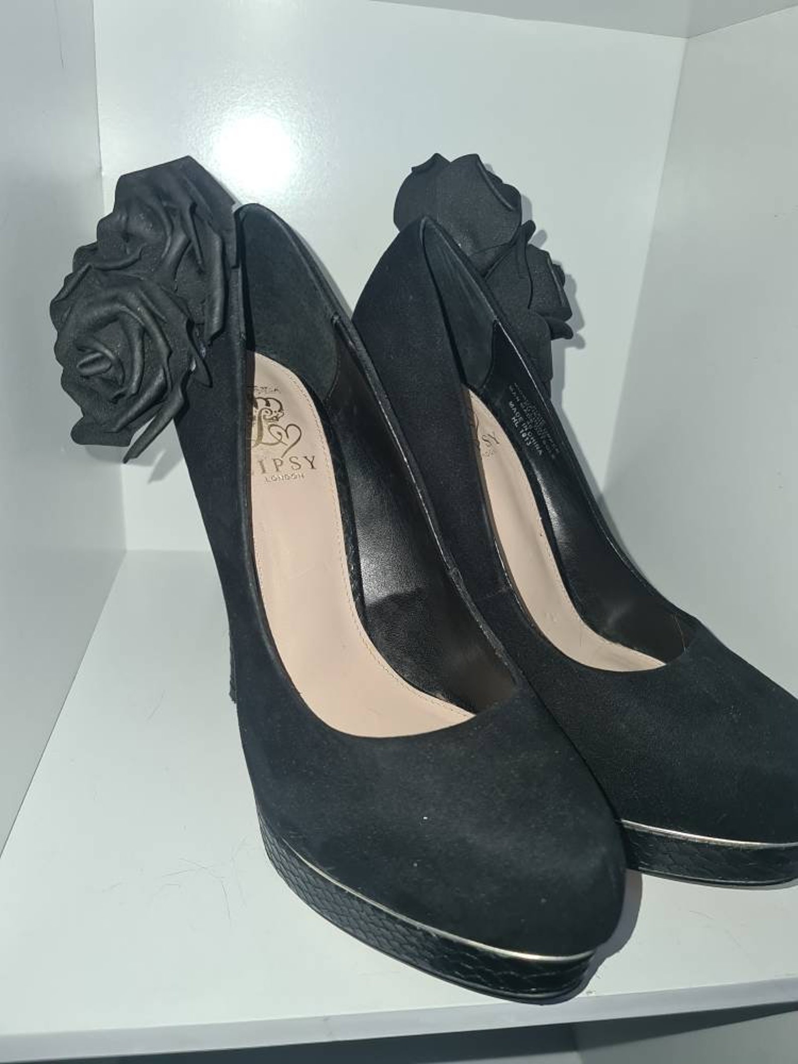 black high heels with roses