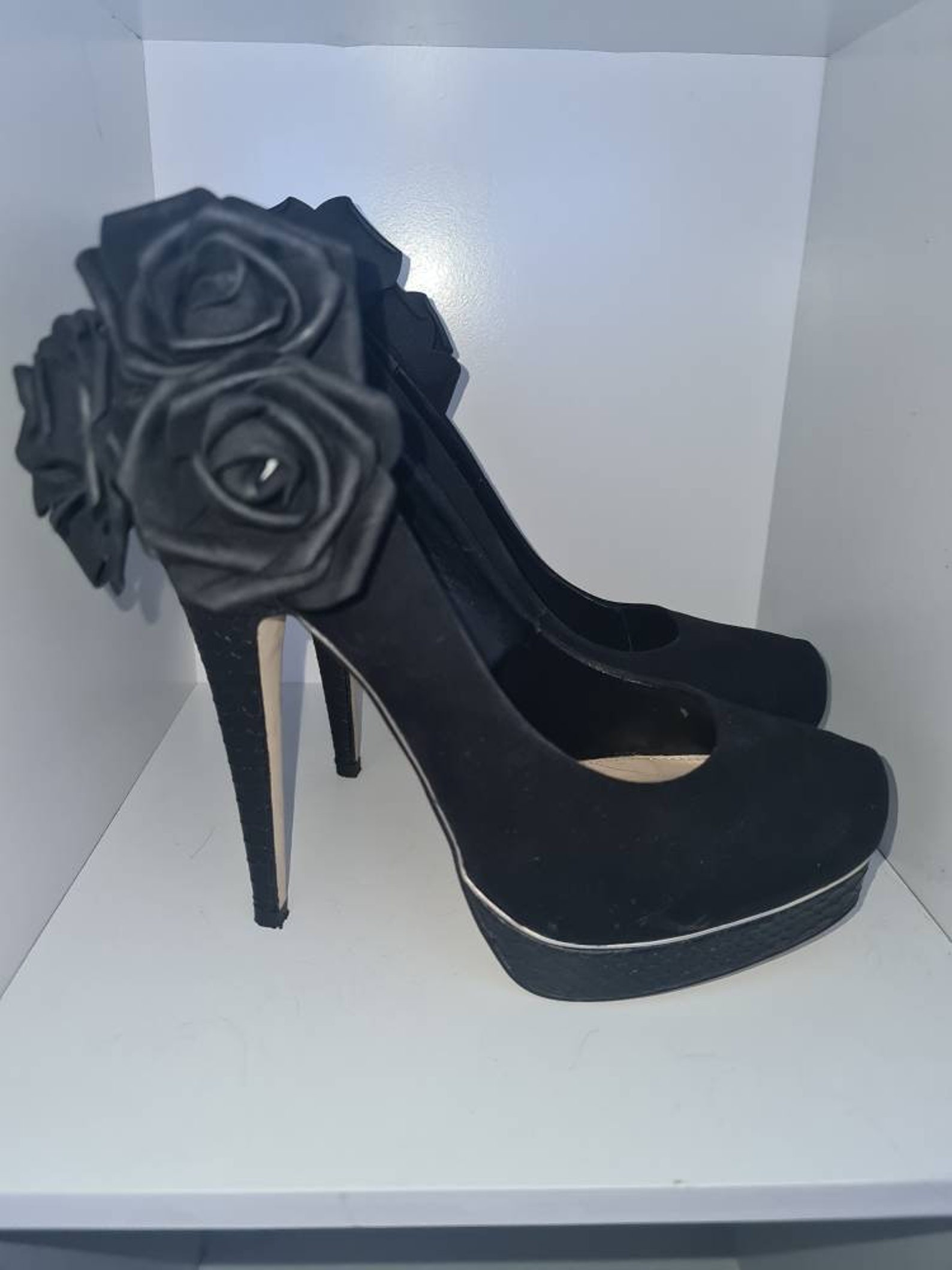 black high heels with roses