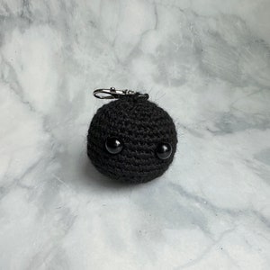 Blackhole keychain plush amigurumi toy crocheted with yarn