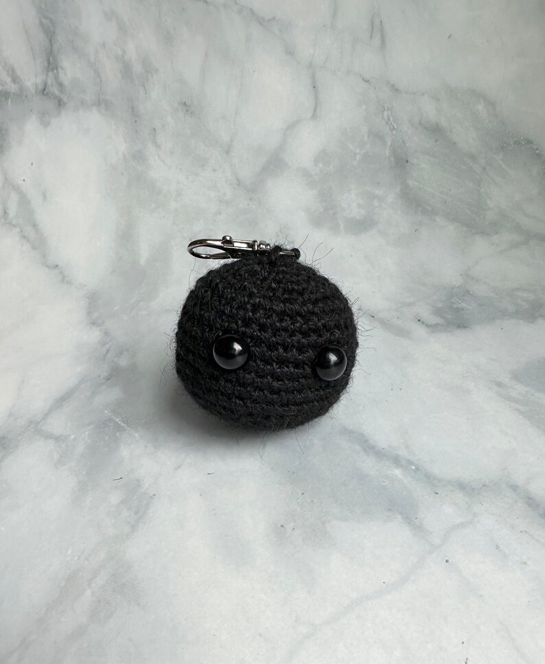 Blackhole keychain plush amigurumi toy crocheted with yarn