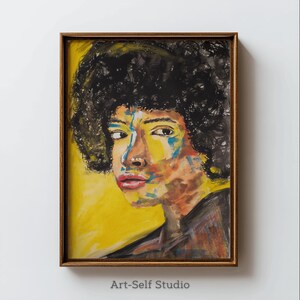 May include: A framed portrait painting featuring a person with dark, curly hair and a colorful face. The artwork uses bold brushstrokes of yellow, blue, red, and orange against a yellow background. The frame is a warm brown color. The text "Art-Self Studio" is at the bottom.