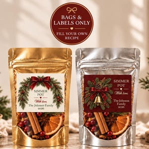 May include: Two stand-up pouches, one gold and one silver, filled with dried fruit, cinnamon sticks, and spices. Each features a label with a holiday wreath, the text SIMMER POT, With love, The Johnson Family, and 2026.