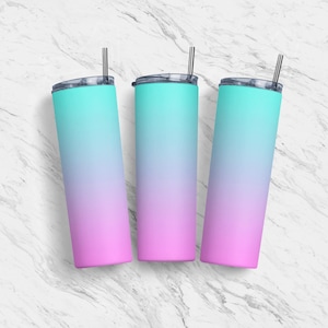 May include: Three stainless steel tumblers with a gradient design. The tumblers are a light blue at the top and fade to pink at the bottom. Each tumbler has a clear lid and a stainless steel straw.
