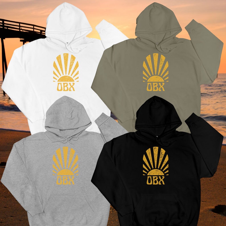 May include: Four hooded sweatshirts in different colors: white, green, gray, and black. Each sweatshirt features a yellow sunburst graphic with the text "OBX" in the center.