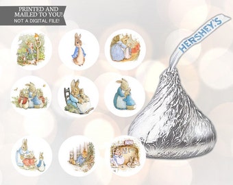 May include: Set of 8 round stickers featuring illustrations of Peter Rabbit and friends. The stickers are printed on white paper and have a glossy finish. The stickers are perfect for adding a touch of whimsy to your gifts, cards, or crafts.