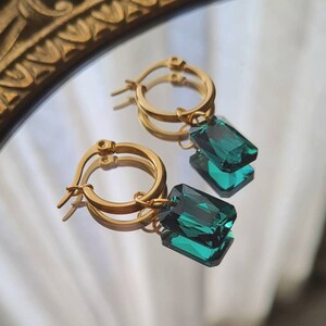 Thick stainless steel gold hoop earrings with faceted rectangle pendant in emerald green crystal, Talisman model