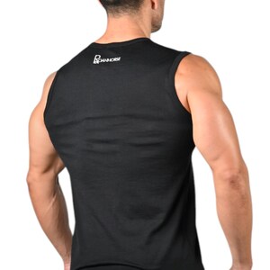 May include: Black tank top with the white text "BOANHORSE" on the upper back. The tank top is sleeveless and made of a soft material. The person in the image is wearing blue shorts. The image is taken from the back.