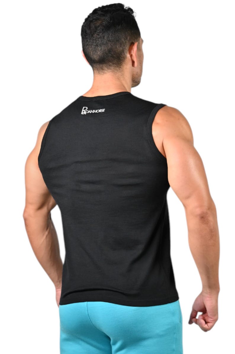 May include: Black tank top with the white text "BOANHORSE" on the upper back. The tank top is sleeveless and made of a soft material. The person in the image is wearing blue shorts. The image is taken from the back.