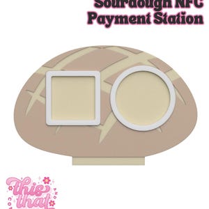 May include: A sourdough-shaped NFC payment station with the text "Sourdough NFC Payment Station". The station has a square and a circular opening, both with white borders. The base is beige with a light beige pattern.