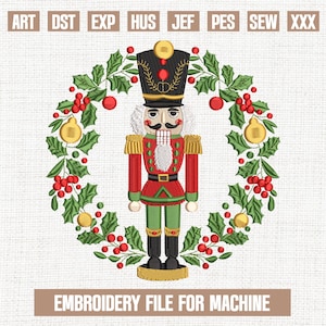 May include: An embroidered design featuring a traditional nutcracker soldier in a red and green uniform, surrounded by a wreath of holly and berries. The text "EMBROIDERY FILE FOR MACHINE" is displayed at the bottom. The design is suitable for machine embroidery.