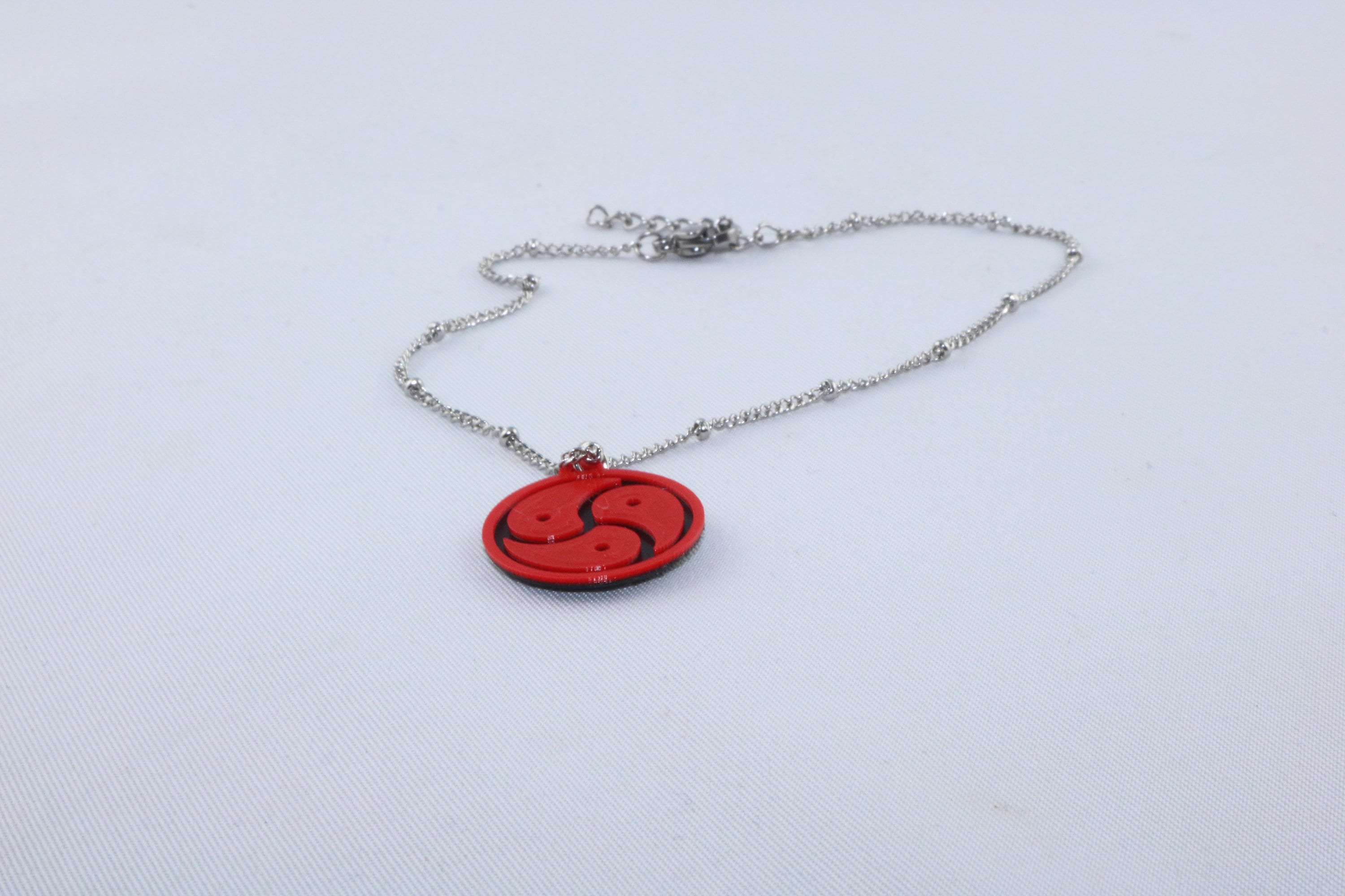 Bracelet De Cheville Discret Symbole BDSM - Nuances Libertines - Plastique - Neuf Avec étiquettes