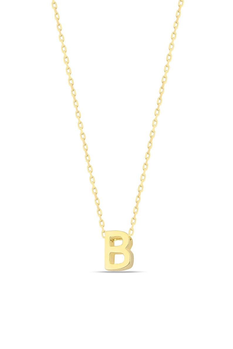 May include: A gold chain necklace with a small, three-dimensional letter 'B' pendant.