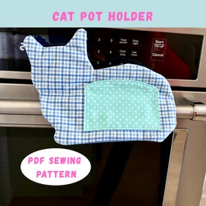 May include: A cat-shaped pot holder made of blue and white checkered fabric with a light blue pocket featuring white polka dots. The text "CAT POT HOLDER" and "PDF SEWING PATTERN" are visible.