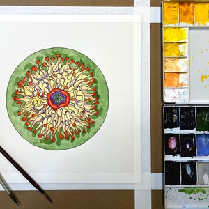 May include: A watercolor painting of a circular mandala with a green, orange, yellow, and purple color scheme. The mandala is surrounded by a white border.