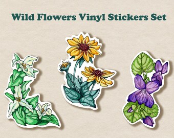 May include: Set of three vinyl stickers featuring illustrations of wild flowers. The stickers feature a white trillium, a yellow coneflower, and a purple violet.