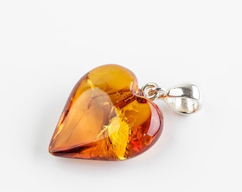 Natural Baltic Amber cognac color polished heart shape amber pendant. 925 silver
