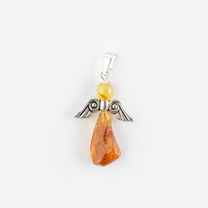 May include: A silver angel pendant with amber wings and a teardrop-shaped amber body.