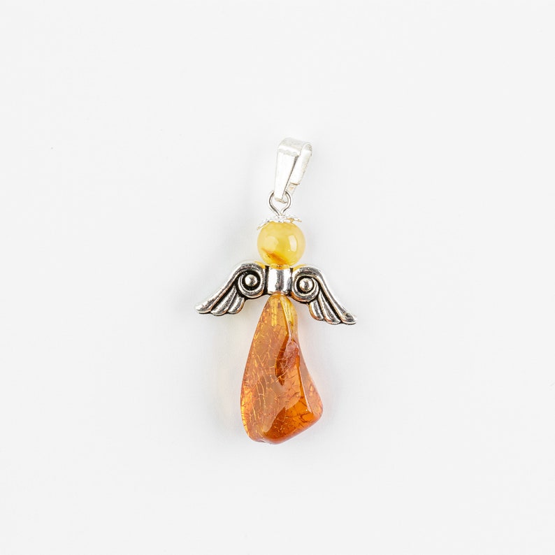 May include: A silver angel pendant with amber wings and a teardrop-shaped amber body.
