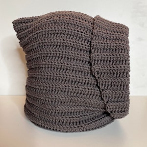 Crochet neck cowl in brown yarn.