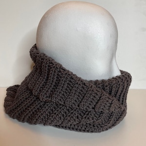 Turtleneck Hoodie Crocheted in brown Wool yarn on a styrofoam head.