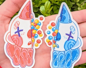 May include: Two colorful stickers featuring cartoon characters with candy spilling out of their heads. The sticker on the left is pink and red with yellow and red candy. The sticker on the right is blue with blue and yellow candy.