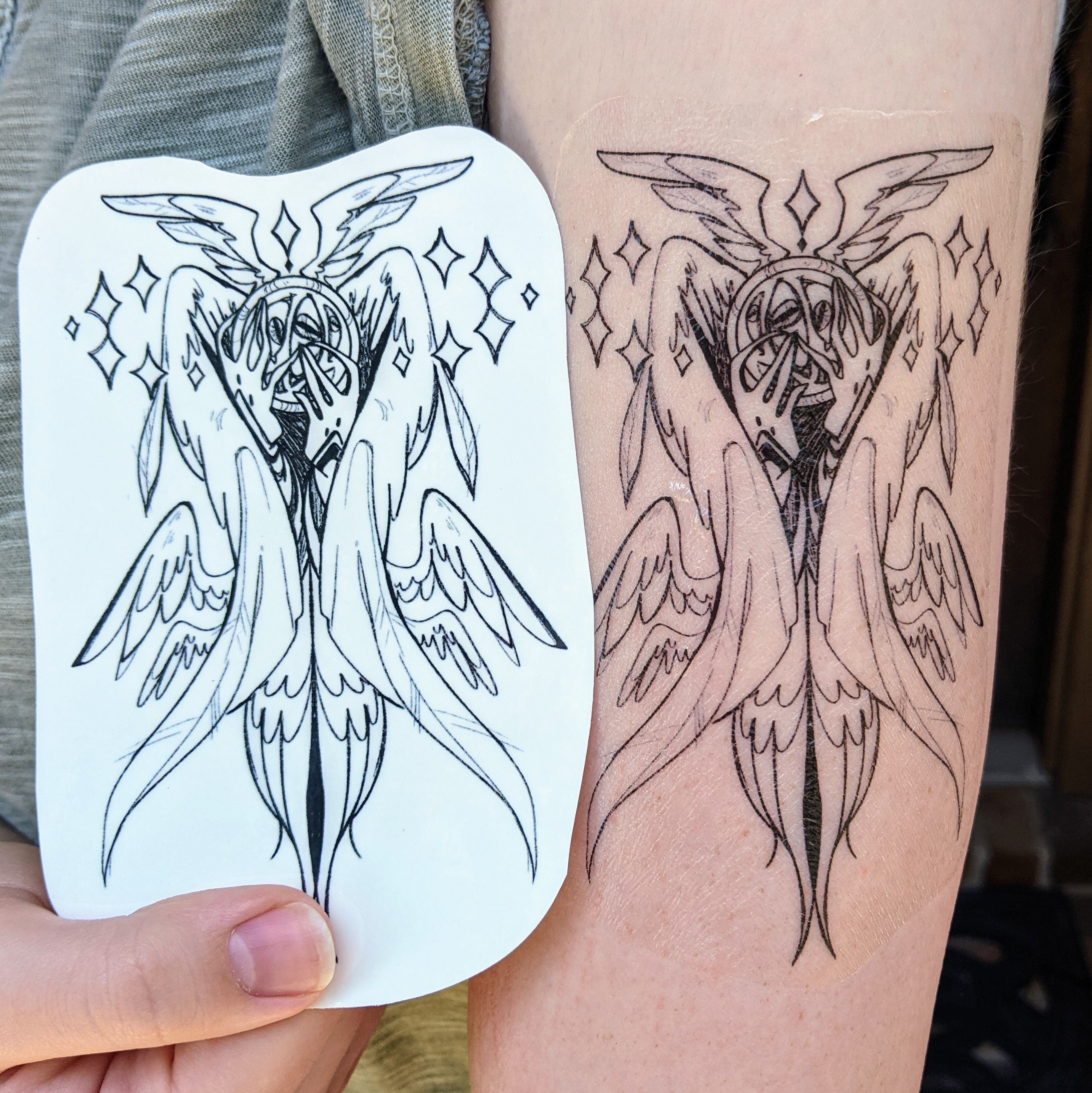 Dark Woman Angel Sitting Tattoo Design – Tattoos Wizard Designs