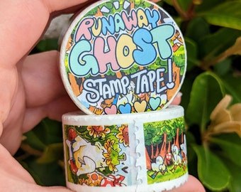 May include: Two rolls of washi tape. The top roll features a colourful design with the text "Runaway Ghost Stamp Tape!" The bottom roll has a colourful design with a white ghost and flowers.