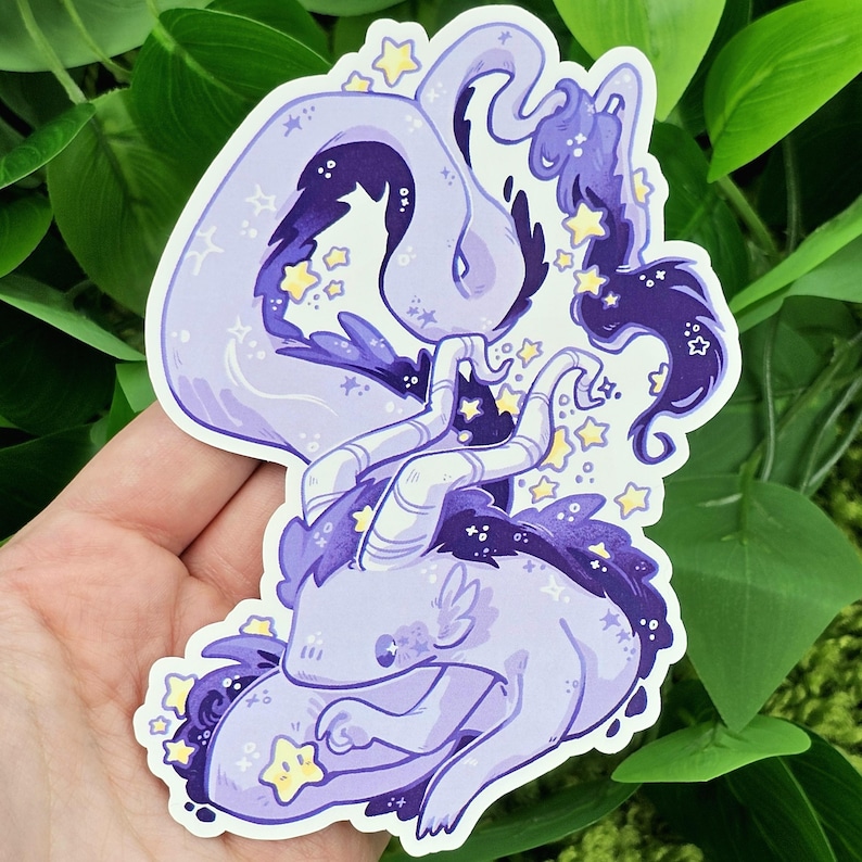 May include: A purple and blue cartoon dragon with stars and swirls. The dragon is curled up in a sleeping position.