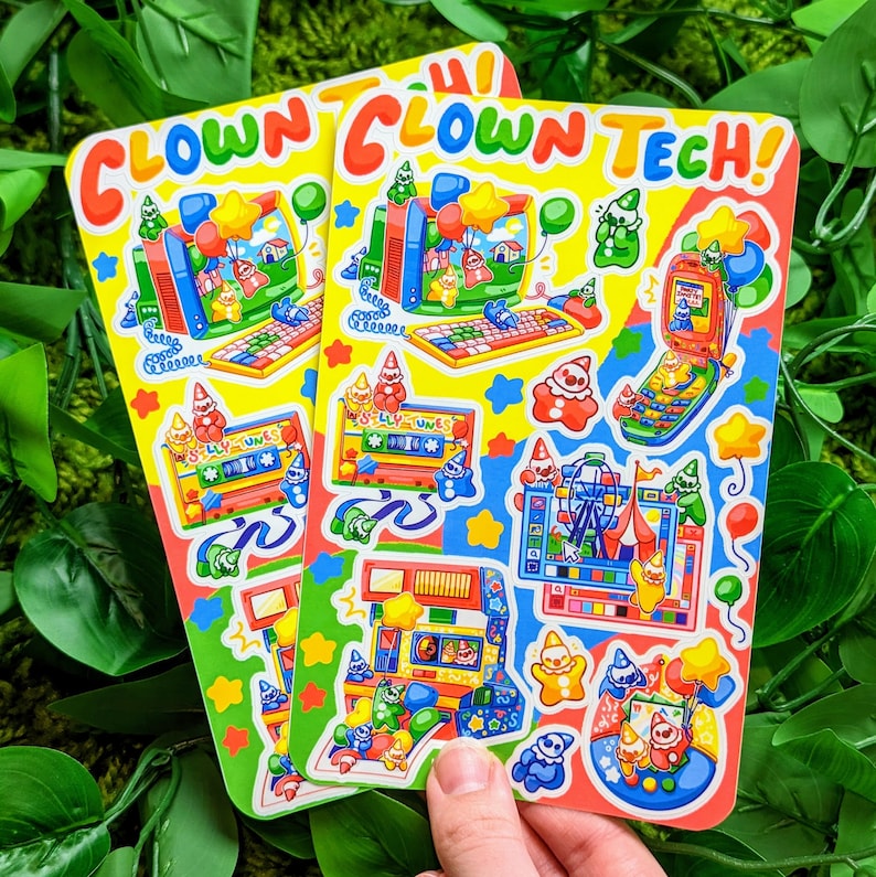 May include: Two colorful sticker sheets with a retro computer theme. The stickers feature a variety of cartoon characters, including clowns, robots, and a computer screen. The text on the stickers reads "Clown Tech!" and "Silly Tunes".