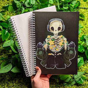 ¡Libro grande de pegatinas reutilizables "Esqueleto escalofriante con flores"!