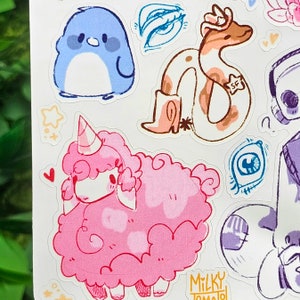 May include: A collection of colorful hand-drawn stickers featuring a pink fluffy sheep with a unicorn horn, a blue penguin, a brown and white snake wearing a cowboy boot, and a blue eye.