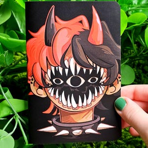May include: A black and red illustration of a person with horns and a large, toothy mouth. The person has a single eye in the center of their face. The person is wearing a black choker with spikes.