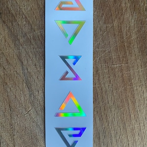 May include: Five iridescent holographic stickers with different triangle designs. The stickers are arranged vertically on a white background.