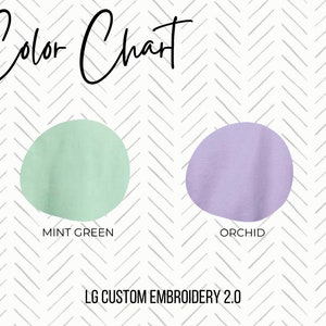 May include: Color chart with two swatches of fabric. The first swatch is mint green and the second swatch is orchid. The text "LG CUSTOM EMBROIDERY 2.0" is below the swatches.