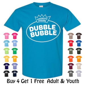 May include: A turquoise t-shirt featuring the "Dubble Bubble" logo in white, with the text "America's Original" above the logo. The image also shows a variety of t-shirt colors, including pink, blue, green, yellow, purple, black, brown, and grey.
