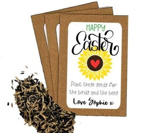 May include: A brown paper packet with a white label that says "Happy Easter" with a sunflower graphic and the text "Plant these seeds for the birds and the bees Love Sophie x".