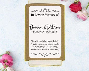 May include: A brown card with a white border and a poem about remembering someone who has passed away. The card reads "In Loving Memory of Doreen Watson 13/01/1947 - 25/03/2023 Tears like raindrops gently fall, A quiet mourning, hearts recall. In every tear, a love we keep, A bond that time will never seep."