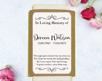 May include: A brown card with a white border and a black inscription that reads "In Loving Memory of Doreen Watson 13/01/1947 - 25/03/2023". The card also includes a poem about remembering loved ones.
