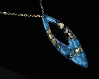 Blue oval shaped necklace and gold leaf in stainless steel and UV resin