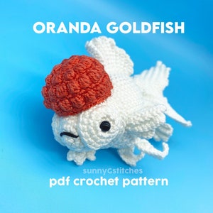 May include: Crochet pattern for a white and orange Oranda goldfish. The pattern is available as a PDF download. The text "sunnyGstitches pdf crochet pattern" is at the bottom of the image.