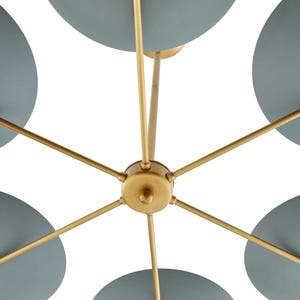 A close-up view of the central brass hub and rod connections of the sputnik chandelier.