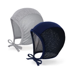 May include: Two sun bonnets. One is gray, the other is navy blue. Both bonnets have a mesh front and ties under the chin. The gray bonnet has a solid gray top, while the navy bonnet has a solid navy blue top. The bonnets are designed to protect the face and neck from the sun.