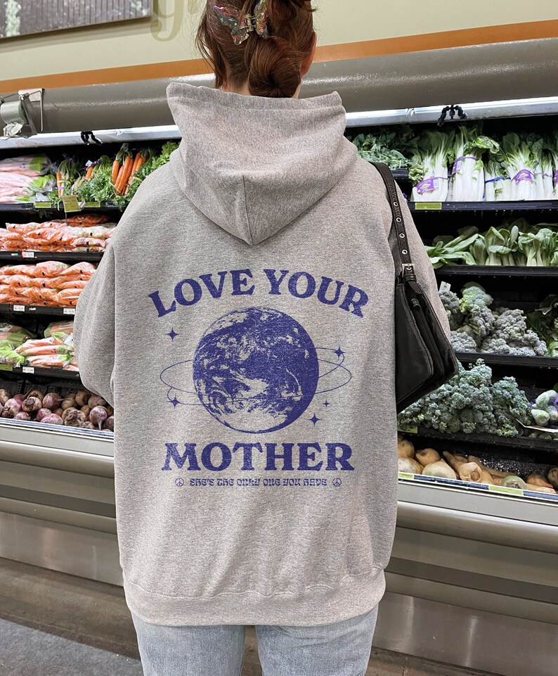 May include: Gray hooded sweatshirt with a blue graphic of the Earth and the text "Love Your Mother" and "She's the only one you have".