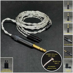 Może przedstawiać: Srebrny kabel audio z czarnym złączem i pozłacanym wtykiem jack 6,35 mm. Kabel ma przekrój 22AWG z 133 żyłami i średnicę zewnętrzną 1,4 mm. Kabel wykonany jest z drutu litzowego 7N OCC o czystości 99,9999%. Kabel jest kompatybilny z słuchawkami Sennheiser HD800/820/8XX.