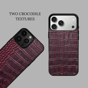 May include: Two smartphone cases featuring a deep burgundy crocodile skin texture. The text TWO CROCODILE TEXTURES is printed above the cases. Each case has a black frame and a camera cutout with multiple lenses visible on the back of the devices.